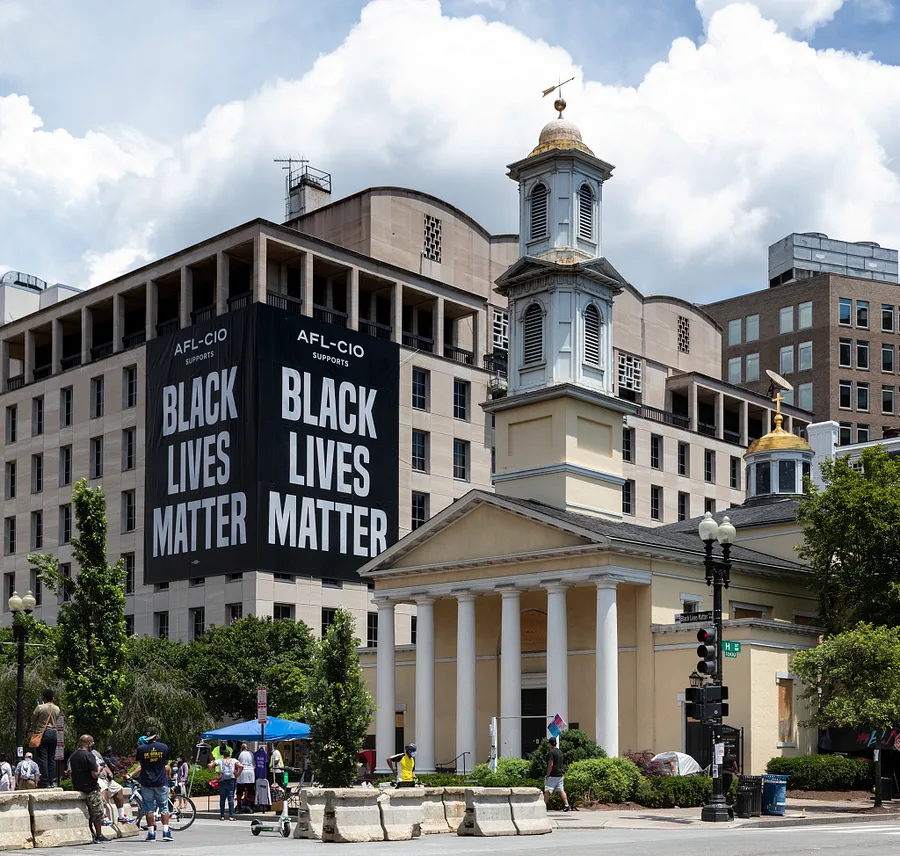 The Black Lives Matter Movement / Contemporary Civil Rights — Black Lives Matter sign next to St. Johns Church on Black Lives Matter Plaza